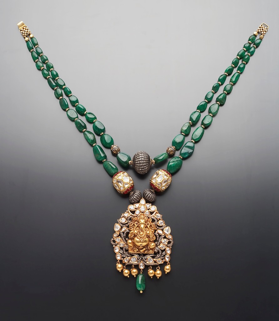 Temple Jewellery recreated with gold Ganesha pendant surrounded by polki diamonds and strung on emeralds