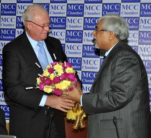 Arun Kumar Saraf  President  MCCI welcoming Mr. Simon Hunt  World known Economist with a Flower Bouquet on 21.01.2015_