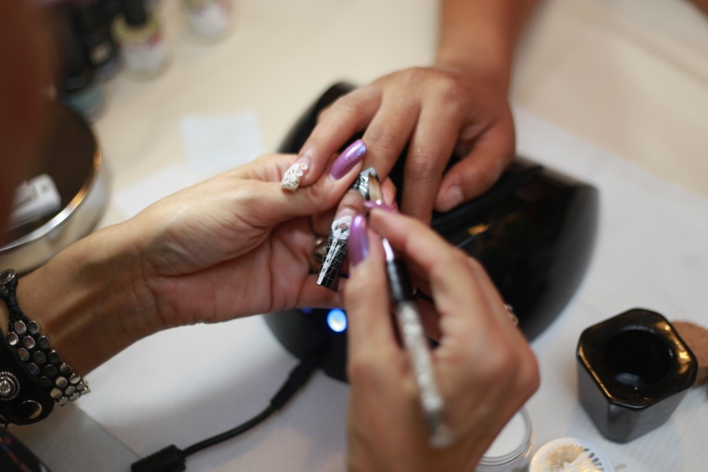 Salon Trainer learning the art of Nail extention at The Artistice Nail Design show (3)