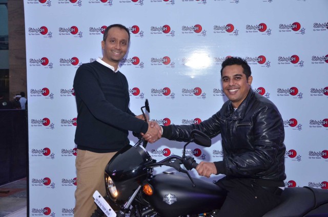 Ashok  Cherian (CMO of SMAAASH with the winner of Harley Davidson at SMAAASH  CyberHub  Gurgaon