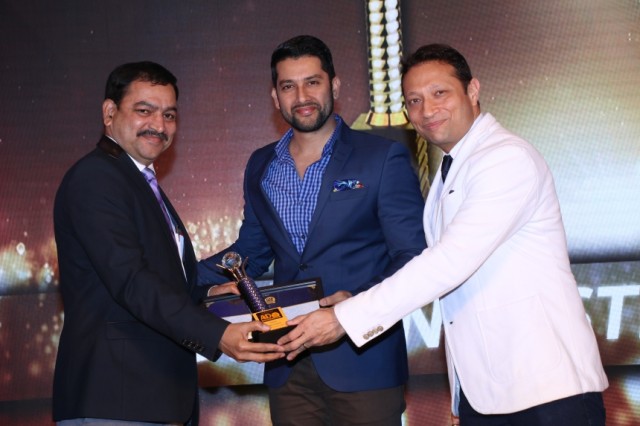 Mr. Nitin Kulkarni from Finolex Industries receiving the award from Mr. ...