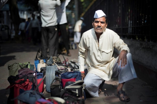 Dabbawalas commuting daily with Mumbai Railways