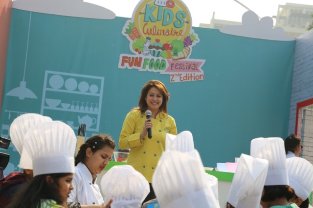 Celebrity Chef Amrita Raichand guiding little chefs at Kids Culinaire