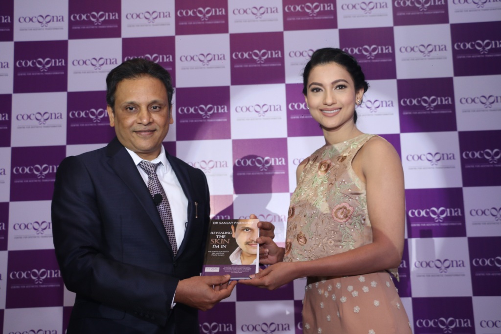Dr. Sanjay Parashar presenting his book to Gauahar Khan during the brand launch here in Delhi today